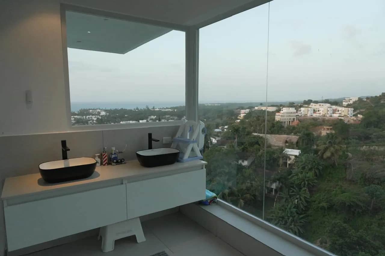 Black designer bathroom with ocean view